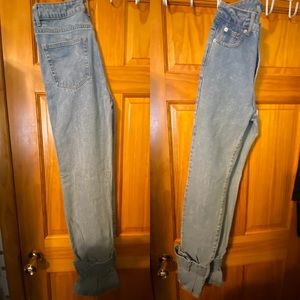 Straight leg jeans with buckle accents at ankles